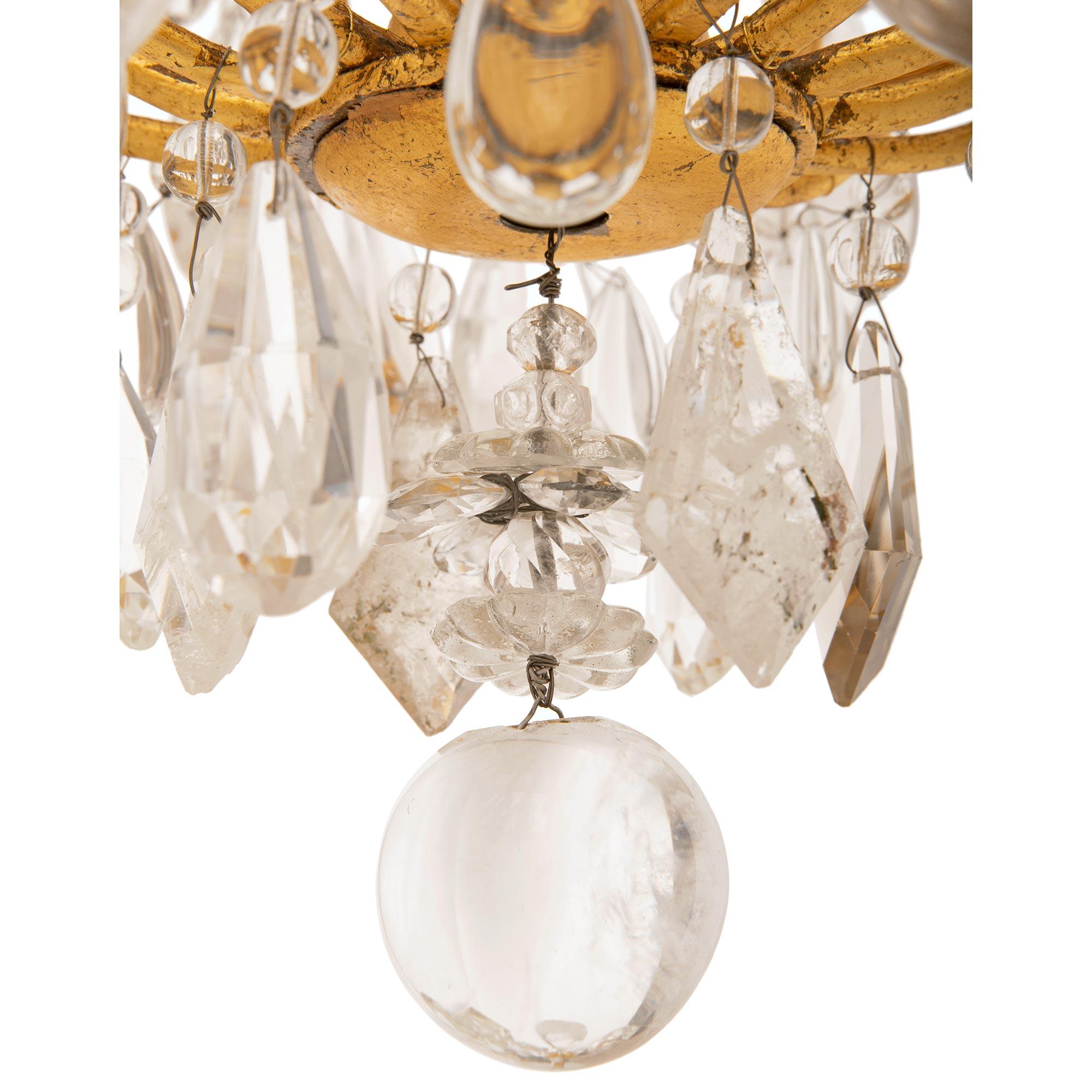 A French 19th century Gilt Iron, crystal and rock crystal chandelier For Sale 1
