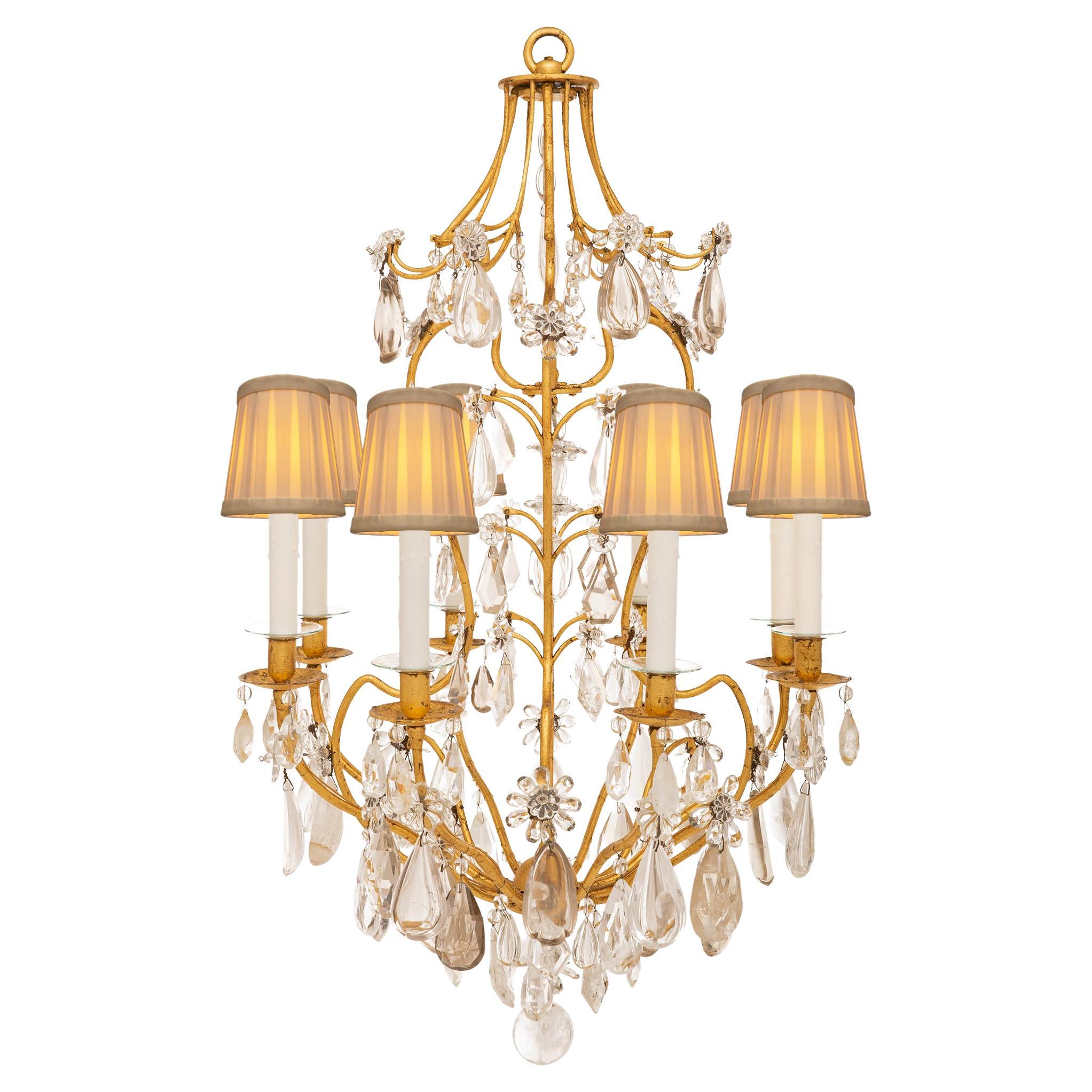 A French 19th century Gilt Iron, crystal and rock crystal chandelier For Sale