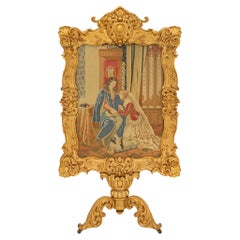 A French 19th century Louis XIV st. Giltwood and Needlepoint freestanding screen