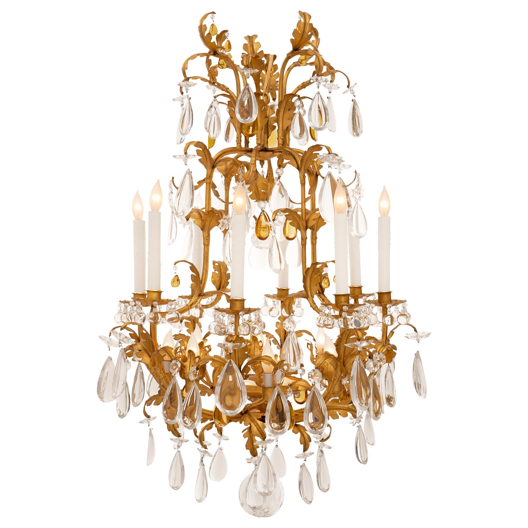A beautiful and extremely decorative French 19th century Louis XV st. gilt metal and Baccarat crystal chandelier. The eight arm eighteen light chandelier is centered by a most elegant hand blown bottom crystal ball with delicate facetted designs