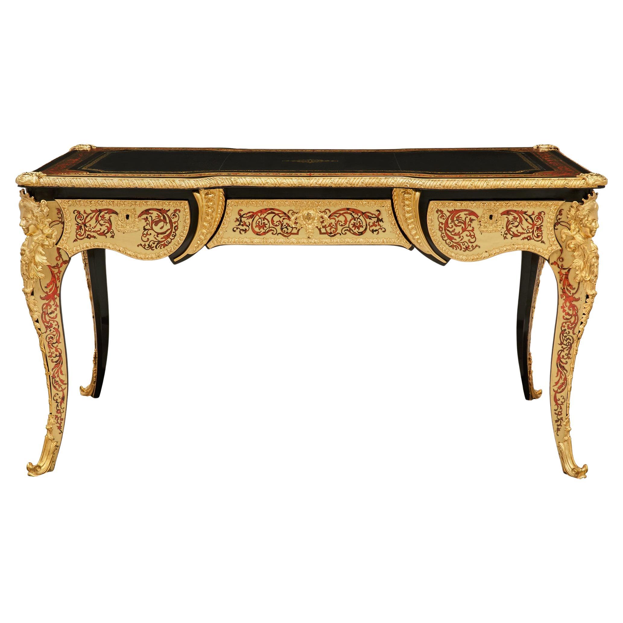A French 19th century Louis XV st. Ebony, Brass, Tortoiseshell and Ormolu desk