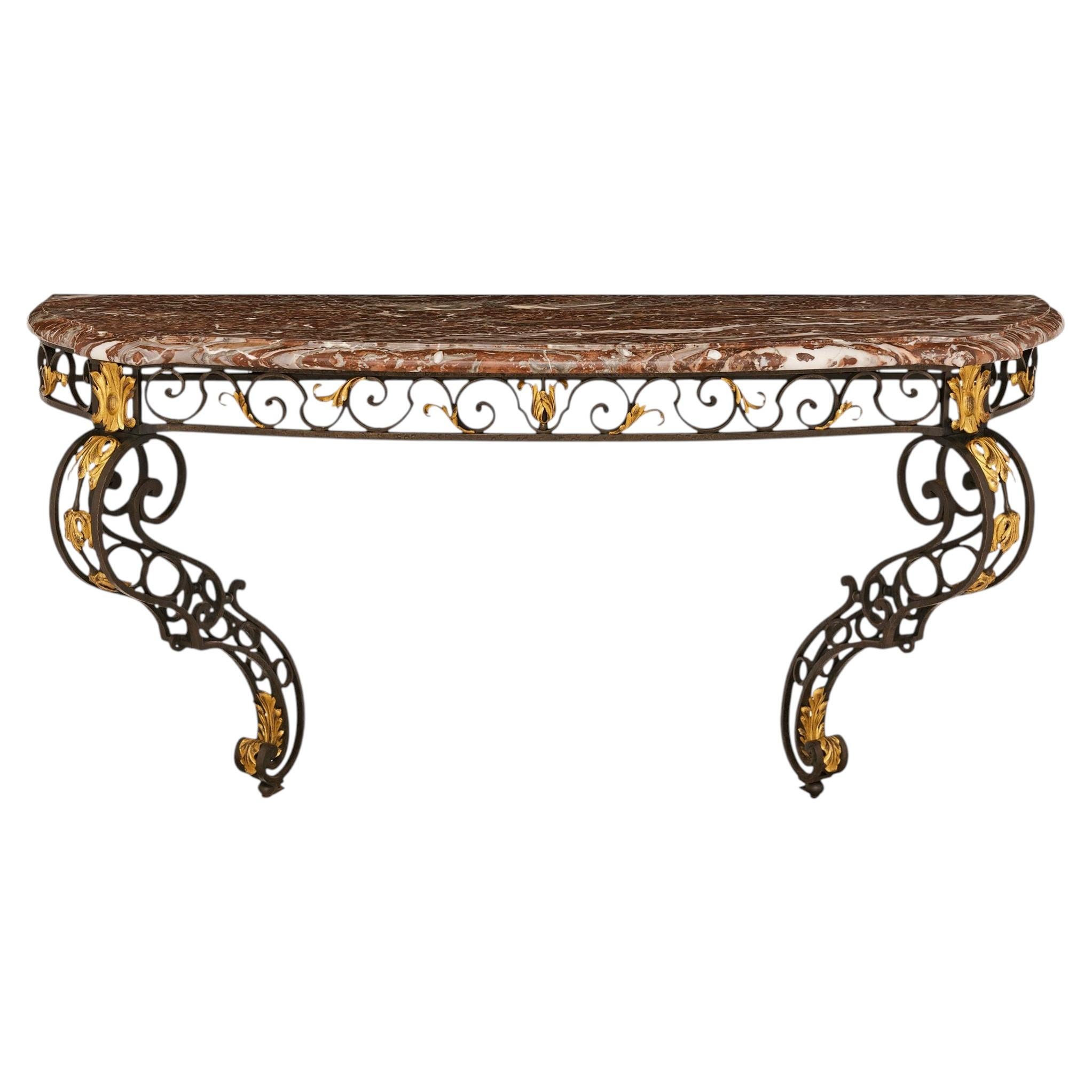 A French 19th century Louis XV st. Wrought Iron, Gilt Metal and Rouge Royale mar