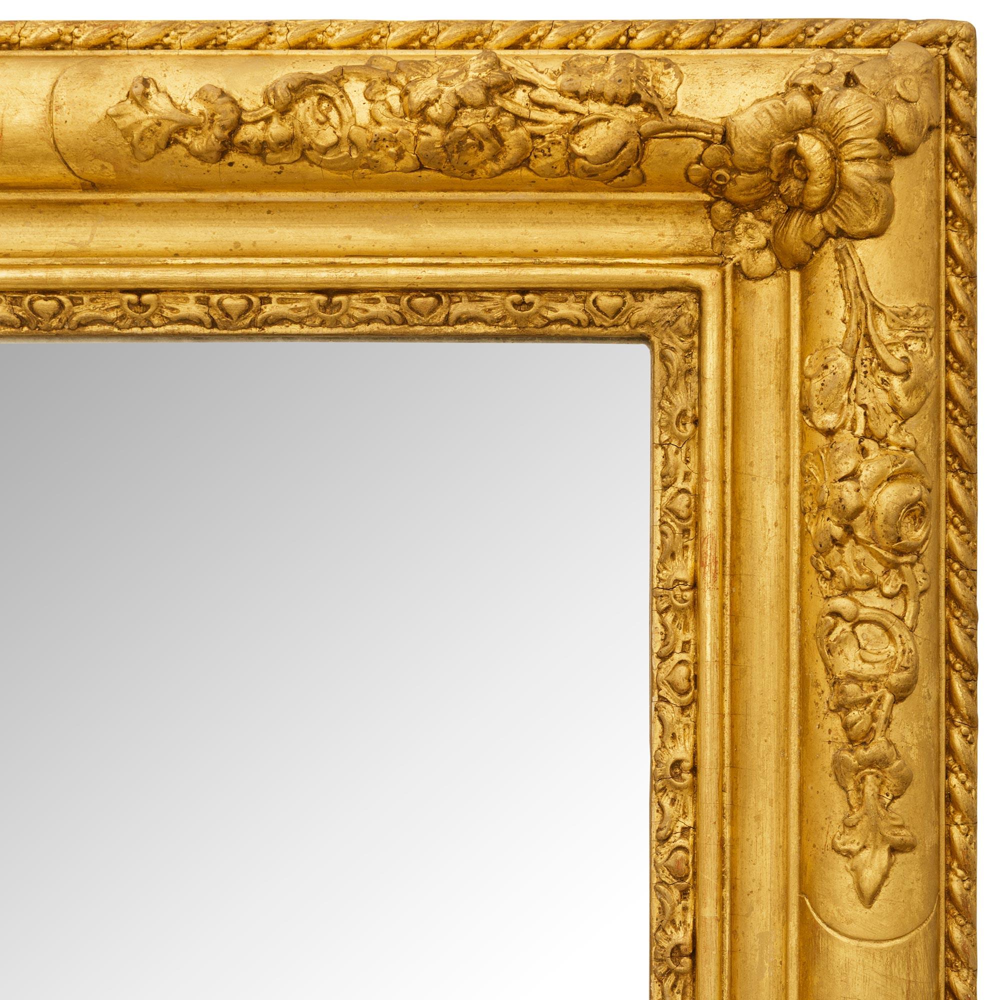 A French 19th century Louis XV/XVI st. Giltwood mirror In Good Condition For Sale In West Palm Beach, FL
