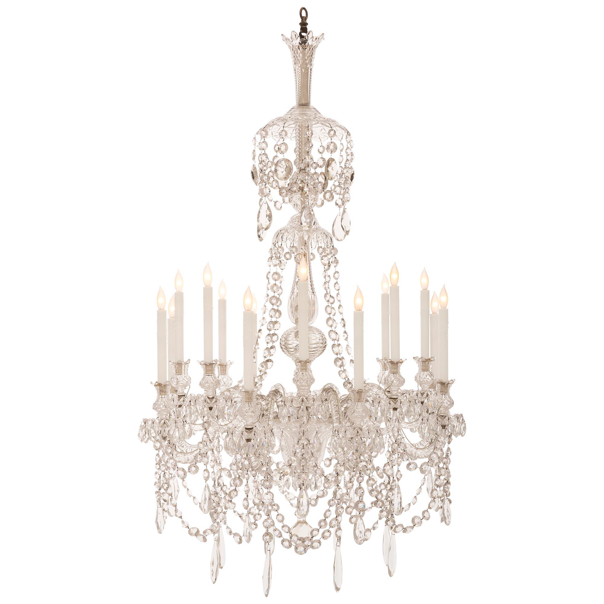 A stunning and most impressive French 19th Louis XVI st. Baccarat crystal chandelier. The sixteen arm chandelier is centered by a beautiful faceted solid crystal ball pendant amidst an exceptional array of cut crystal pendants and beautiful swaging