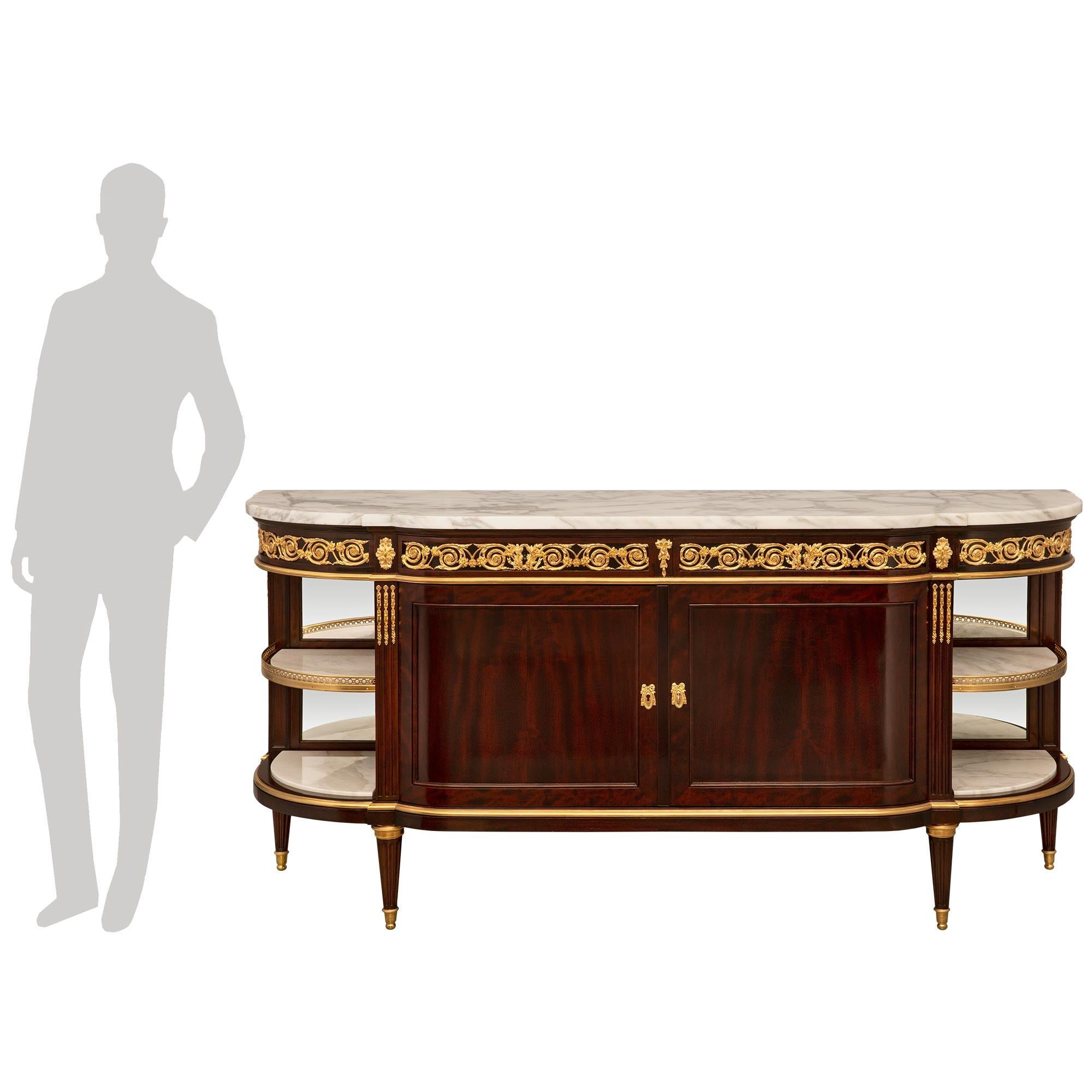 An exceptional and very high quality French 19th century Louis XVI st. Belle Époque period Mahogany, ormolu and Arabescato marble buffet signed by Paul Sormani. The two door four drawer buffet is raised by elegant circular tapered fluted legs with