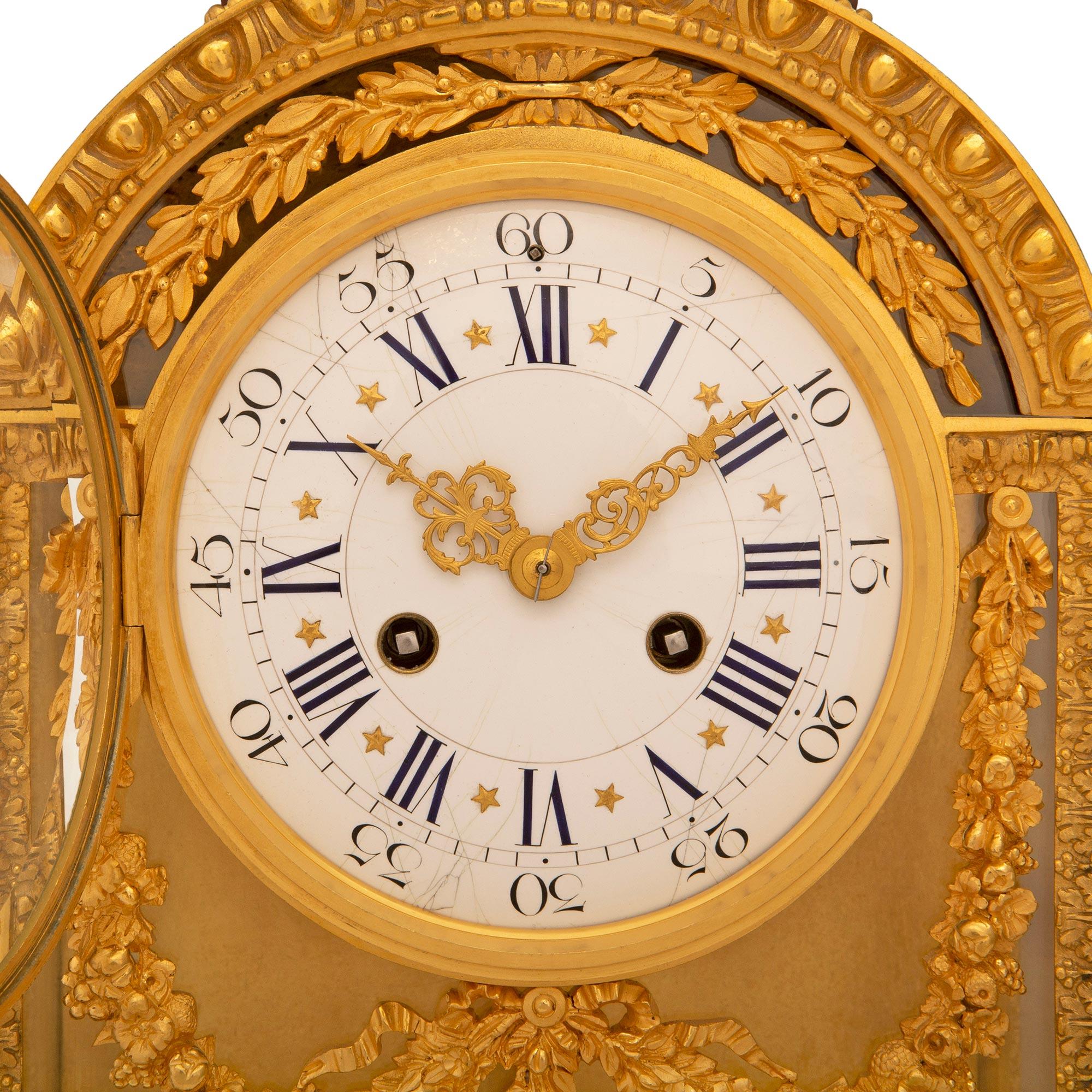A French 19th century Louis XVI st. clock signed Le Merle Charpentier Bronzier For Sale 1