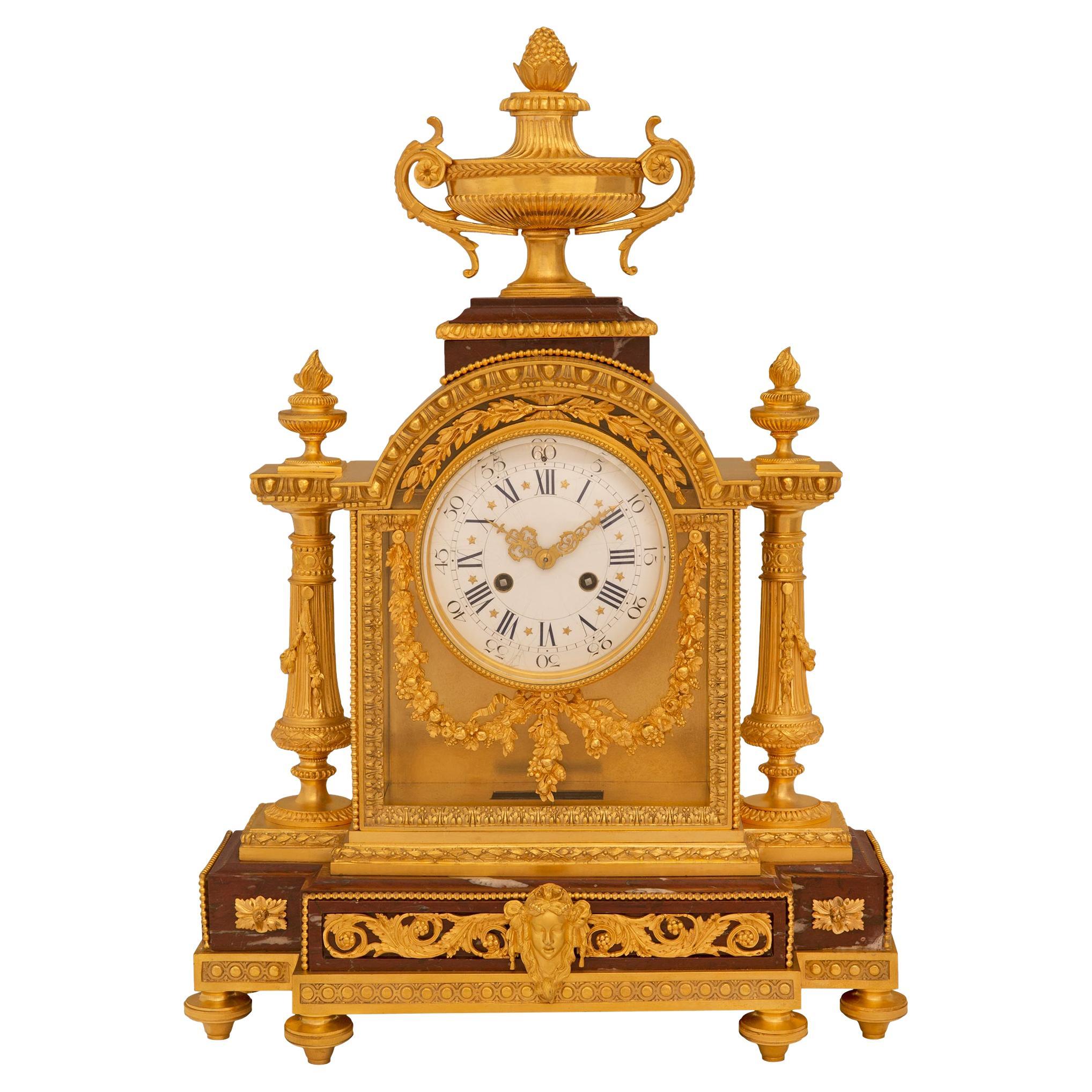 A French 19th century Louis XVI st. clock signed Le Merle Charpentier Bronzier 
