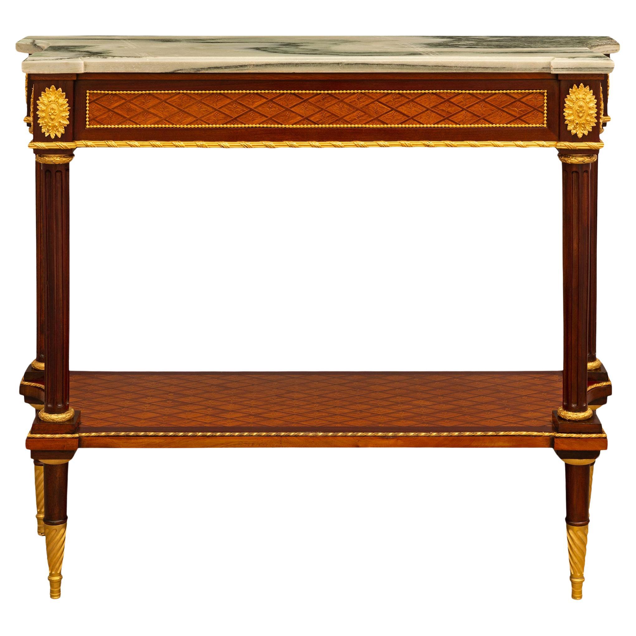 A French 19th century Louis XVI st Ormolu Mahogany Tulipwood marble console