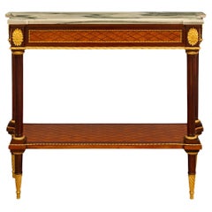 A French 19th century Louis XVI st Ormolu Mahogany Tulipwood marble console