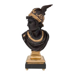 A French 19th century Louis XVI st. patinated bronze & ormolu bust of Mercury.