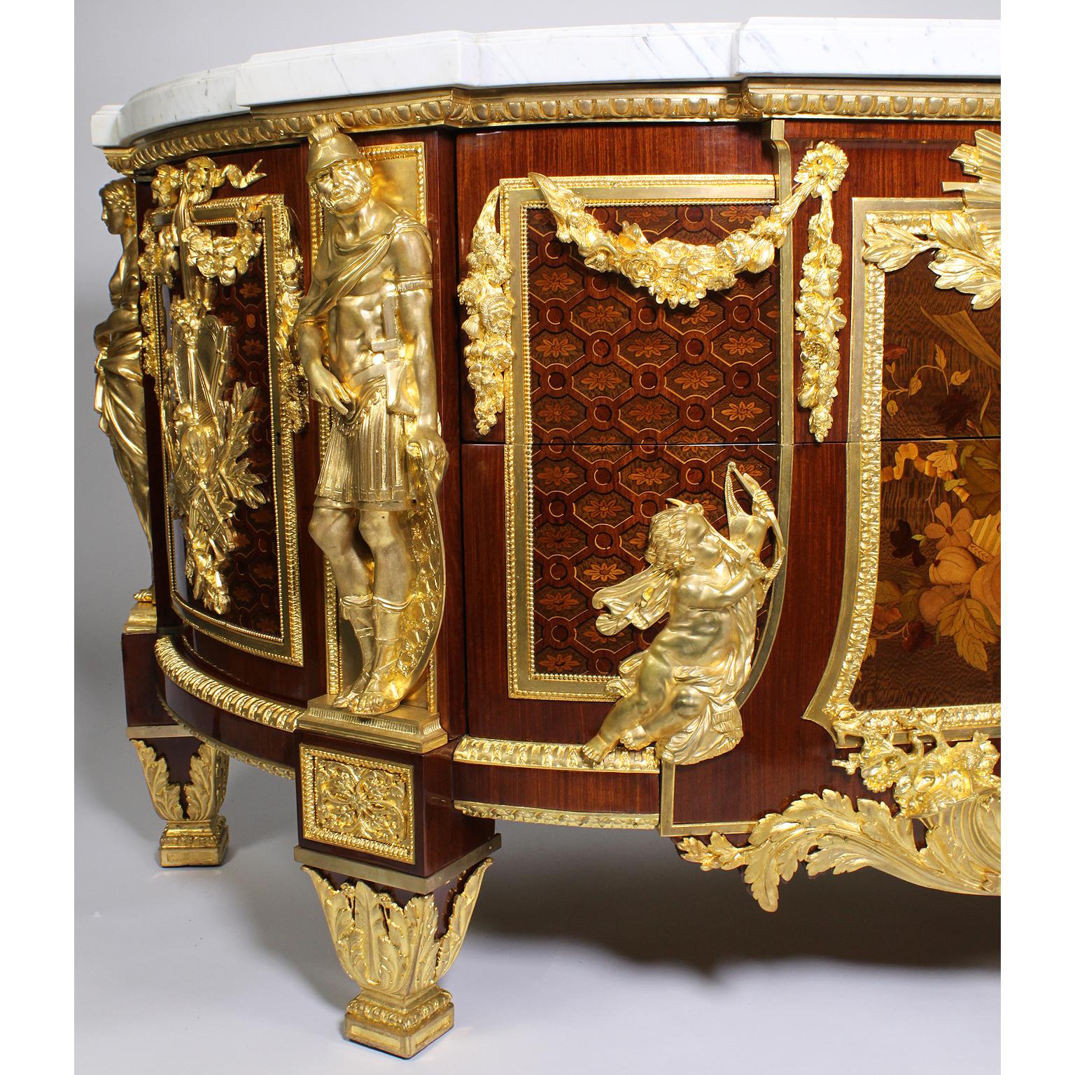 A fine and large French late 19th-20th century Louis XVI style mahogany, Kingwood Bandings and fruitwood marquetry armorial commode with Sycamore Marquertry and gilt bronze mounts, after a Model of The Commode Commandée Pour La Chambre de Louis XVI