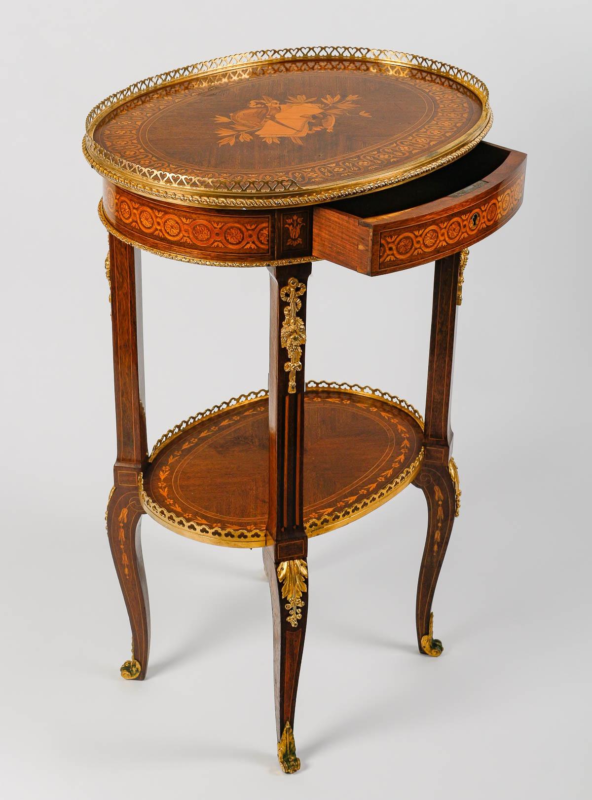 A very good quality 19th century French charming two-tier side table with a single frieze drawer
parquetry inlaid, designed with Allegories of Geography and Astronomy, with pierced three-quarter gallery surround, above a foliate and loop frieze, the