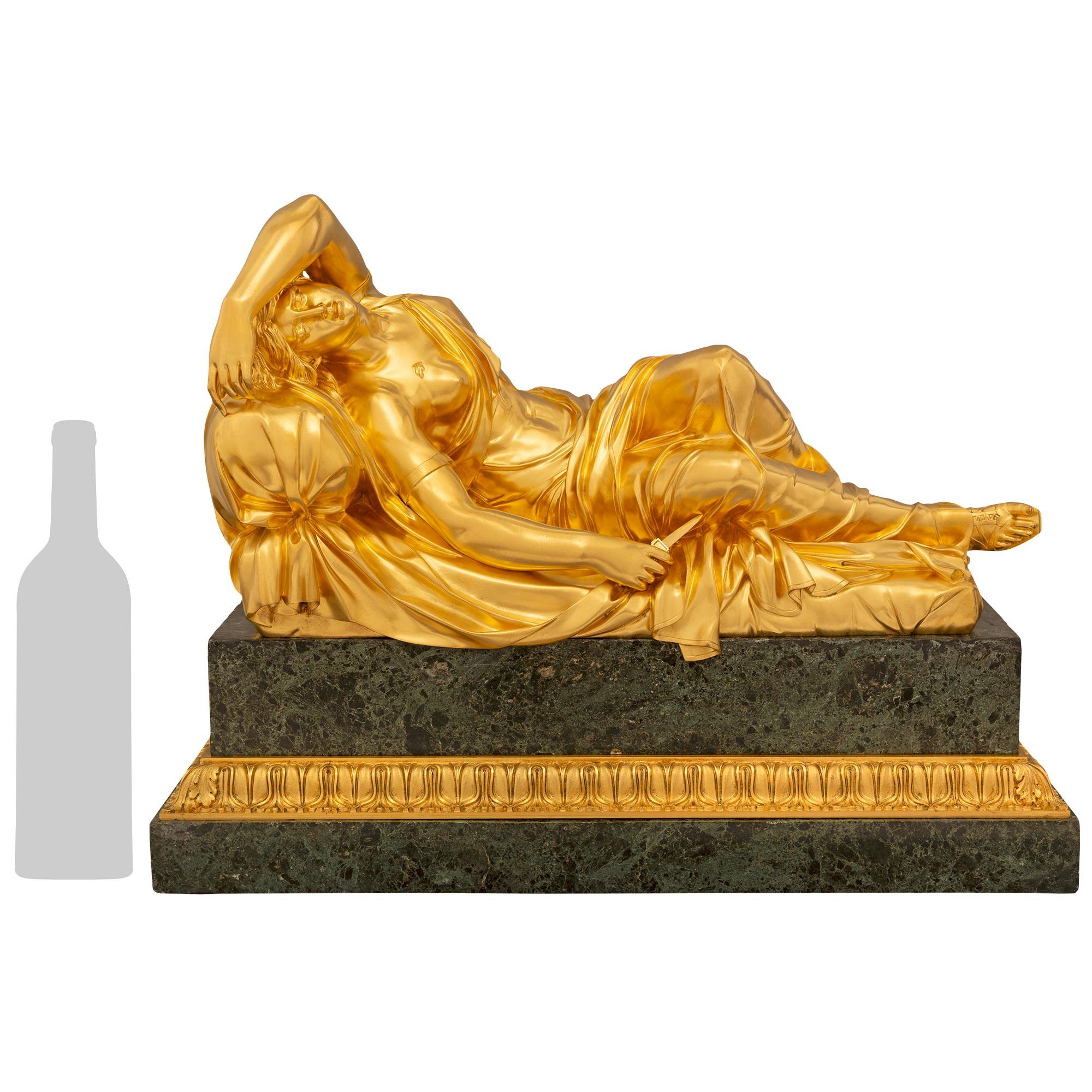 An impressive French 19th century Ormolu and Pietra Braschia marble sculpture of Lucretia. The sculpture is raised by a rectangular Pietra Braschia base with an handsome Coeur de Rai ormolu band. Above is Lucretia laying dying on her bed after