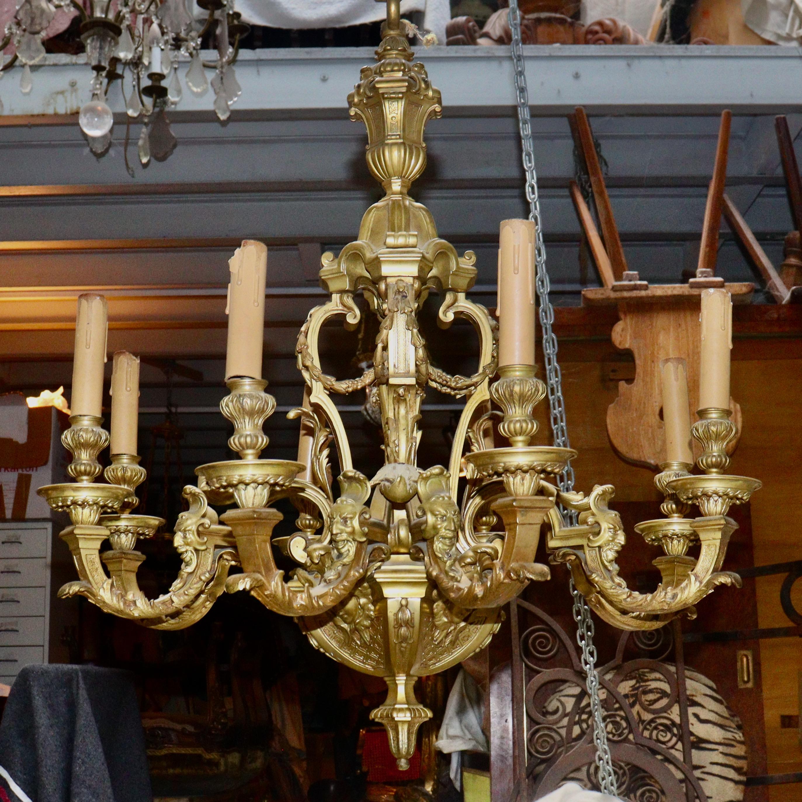 A Louis XIV style ormolu eight-lights chandelier, after the famous model by Andre-Charles Boulle
An Ormolu Eight-lights Chandelier, each arm held by Indian masks with two lights in in-verted console.
The cask in stylized baluster partially adorned