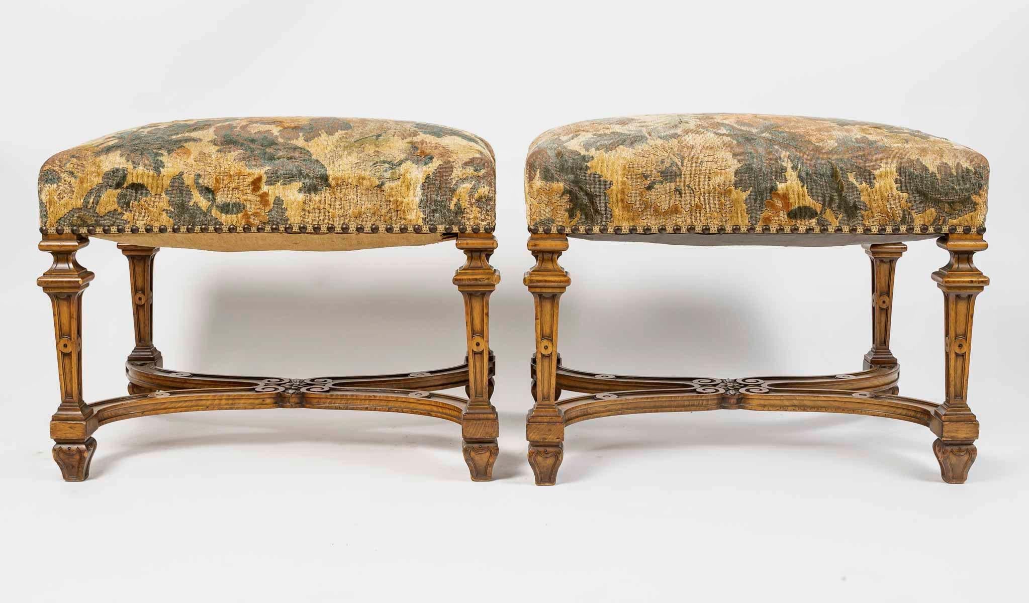 A French 19th Century Pair of Large Rectangular Stools natural and carved wood.
The 4 sheaths feet carved and linked by a stretcher. 
Louis XIV Style 
Napoléon III Period 
Circa 1880
Used Petit Point Tapestry Upholstery 

If the stool played a great