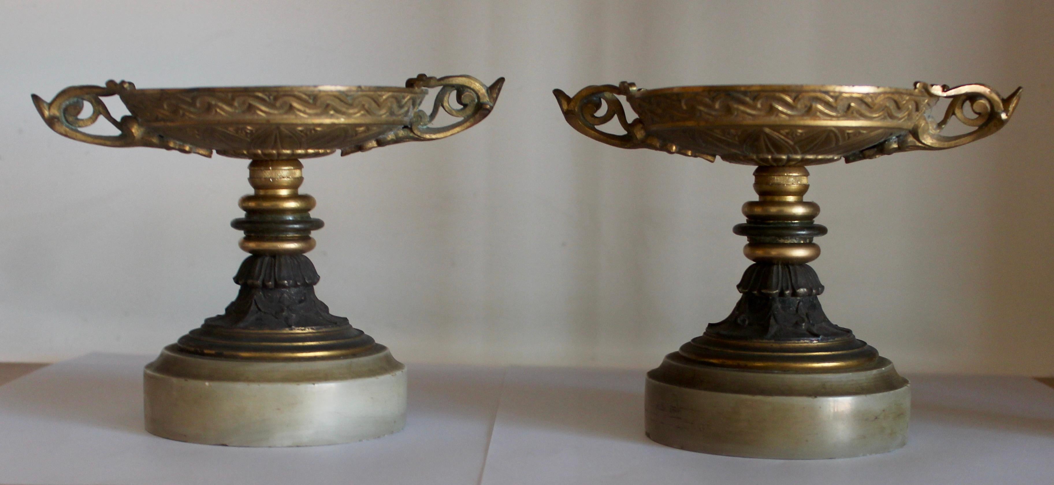 A French 19th century pair of Tazzas
Ormolu and patinated bronze on onyx bases
neoclassical design,
circa 1890.