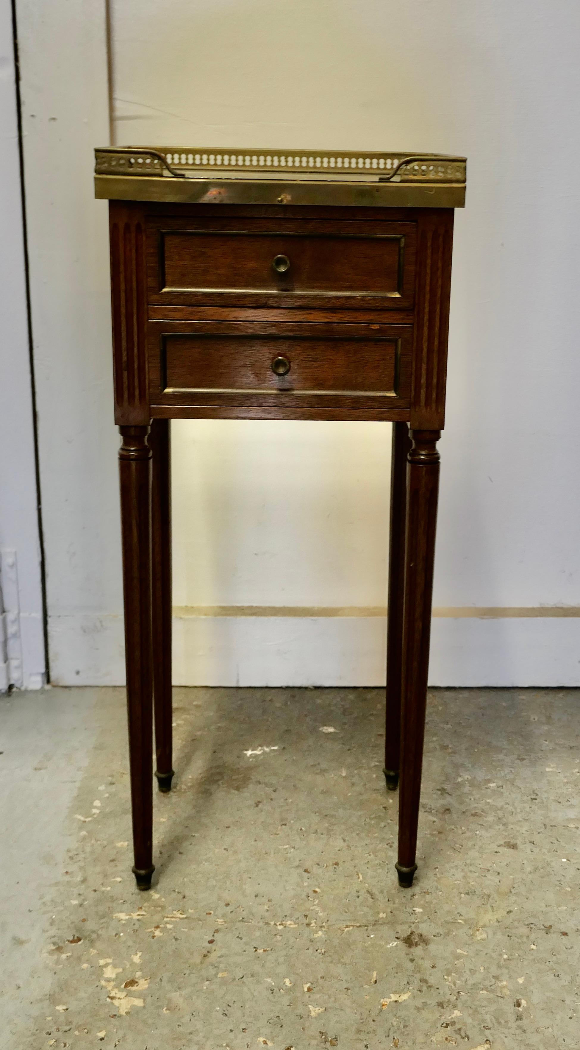 A French 19th Century side table or bedside cabinet 

This is a superb quality French 19th Century marble top table, it has a pierced brass gallery around the top and 2 small drawers to the front
The cabinet is in good condition and would work