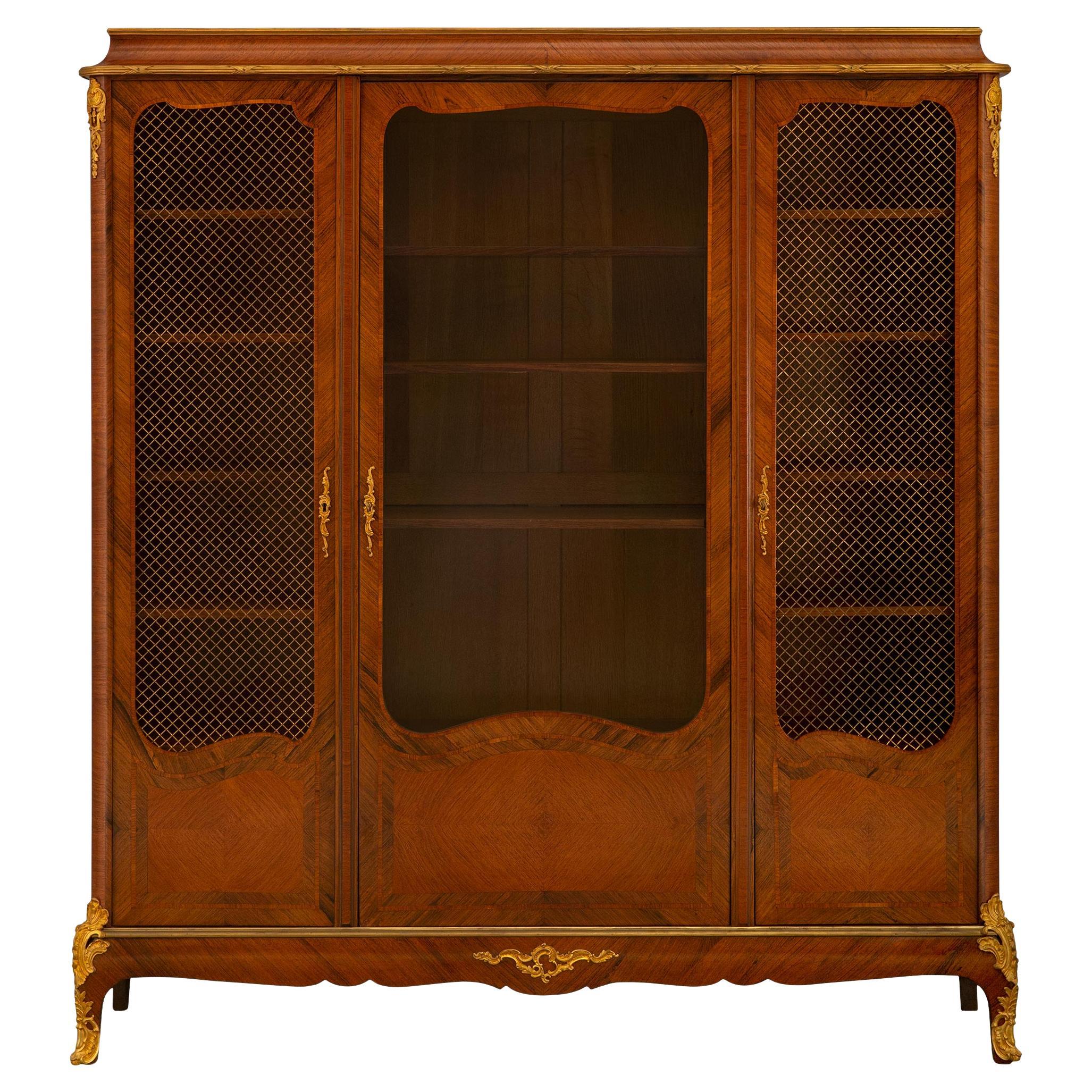 A French 19th century Transitional st. Tulipwood and Ormolu cabinet  For Sale