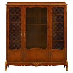 A French 19th century Transitional st. Tulipwood and Ormolu cabinet 