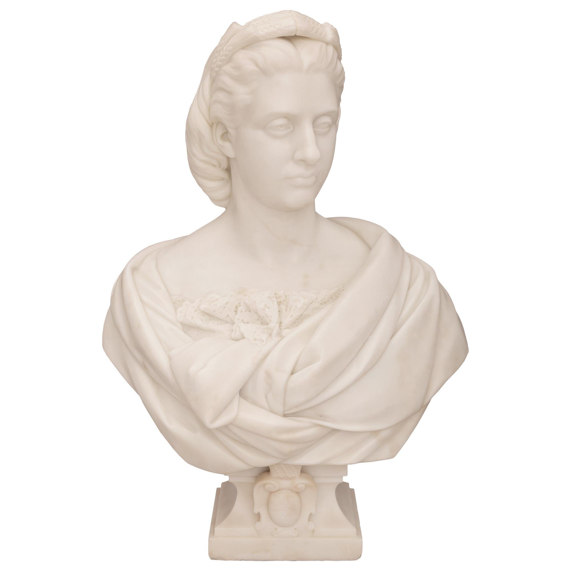 A beautiful and large scale marble French 19th century white Carrara marble bust signed Paul Aubé 1864. The very high quality bust is raised by a square base with an elegantly curved socle shaped support with a mottled border and striking central