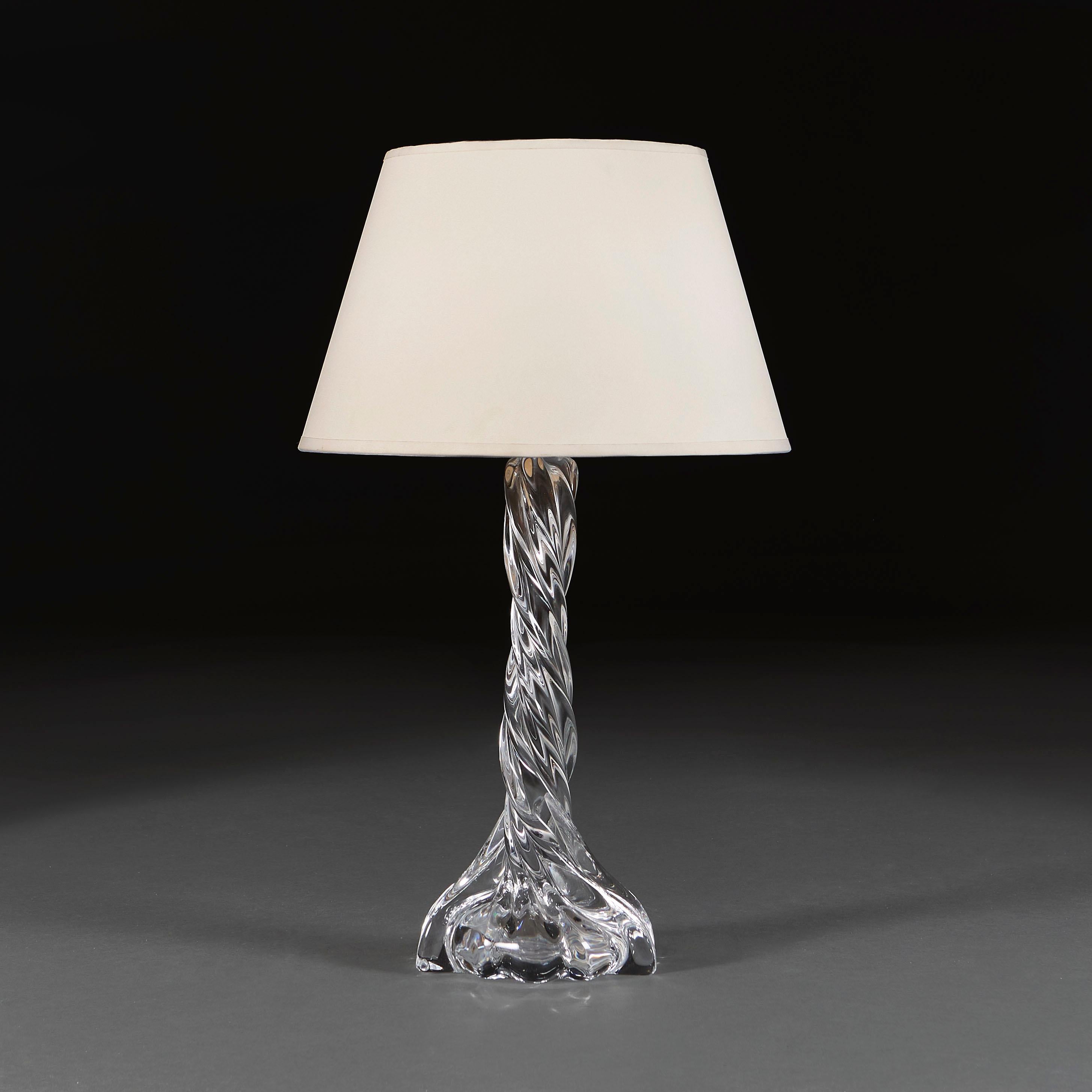 France, circa 1940.
A mid century Baccarat clear glass column lamp of twisted spiral form, stamped Baccarat to the base. 

Louis XV founded Baccarat in 1764 in the well-known glassmaking district of Lorraine. The Royal name behind the company made