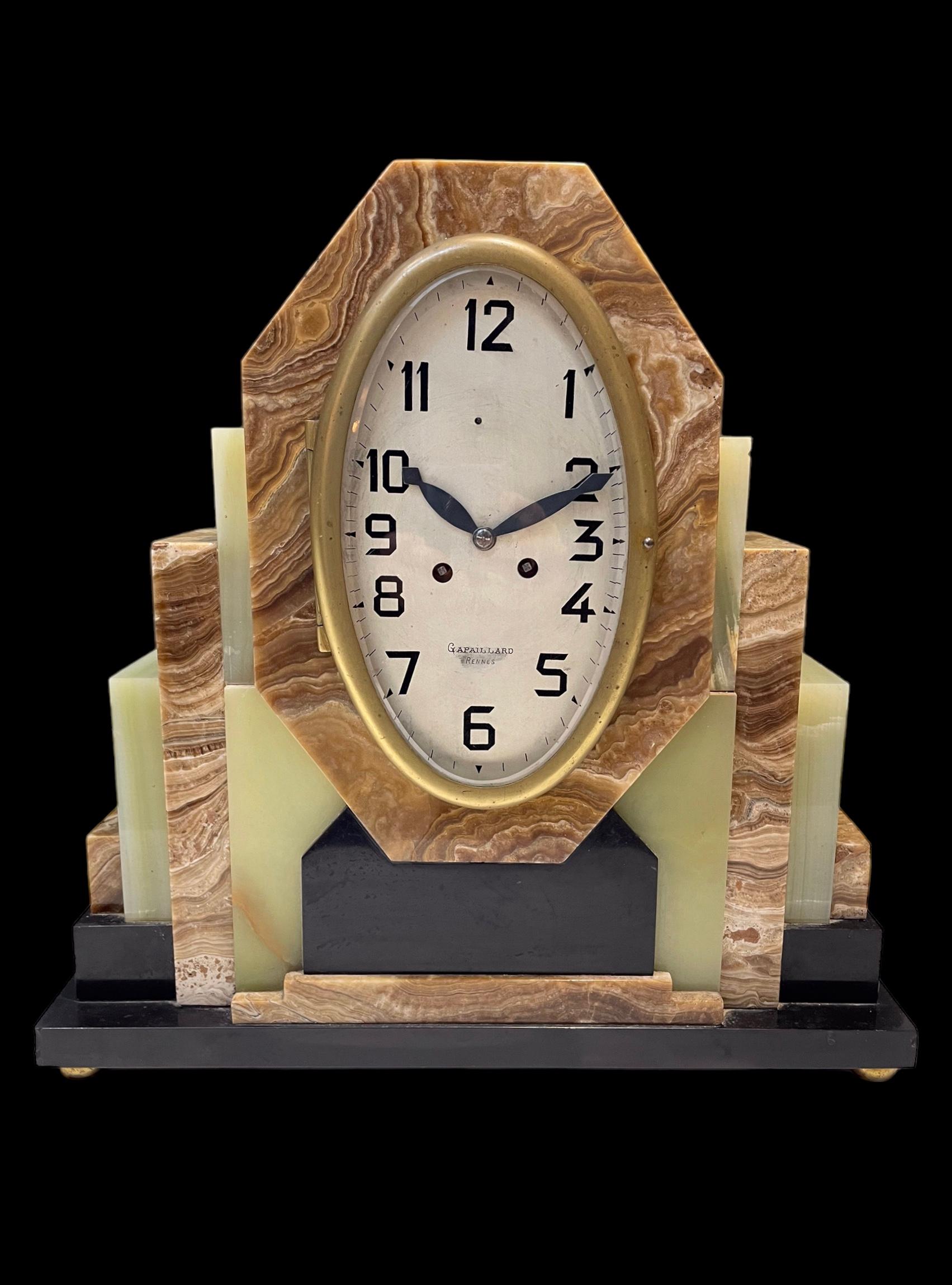 Mid-20th Century A French Art Deco Clock with its matching pair of Garnitures For Sale