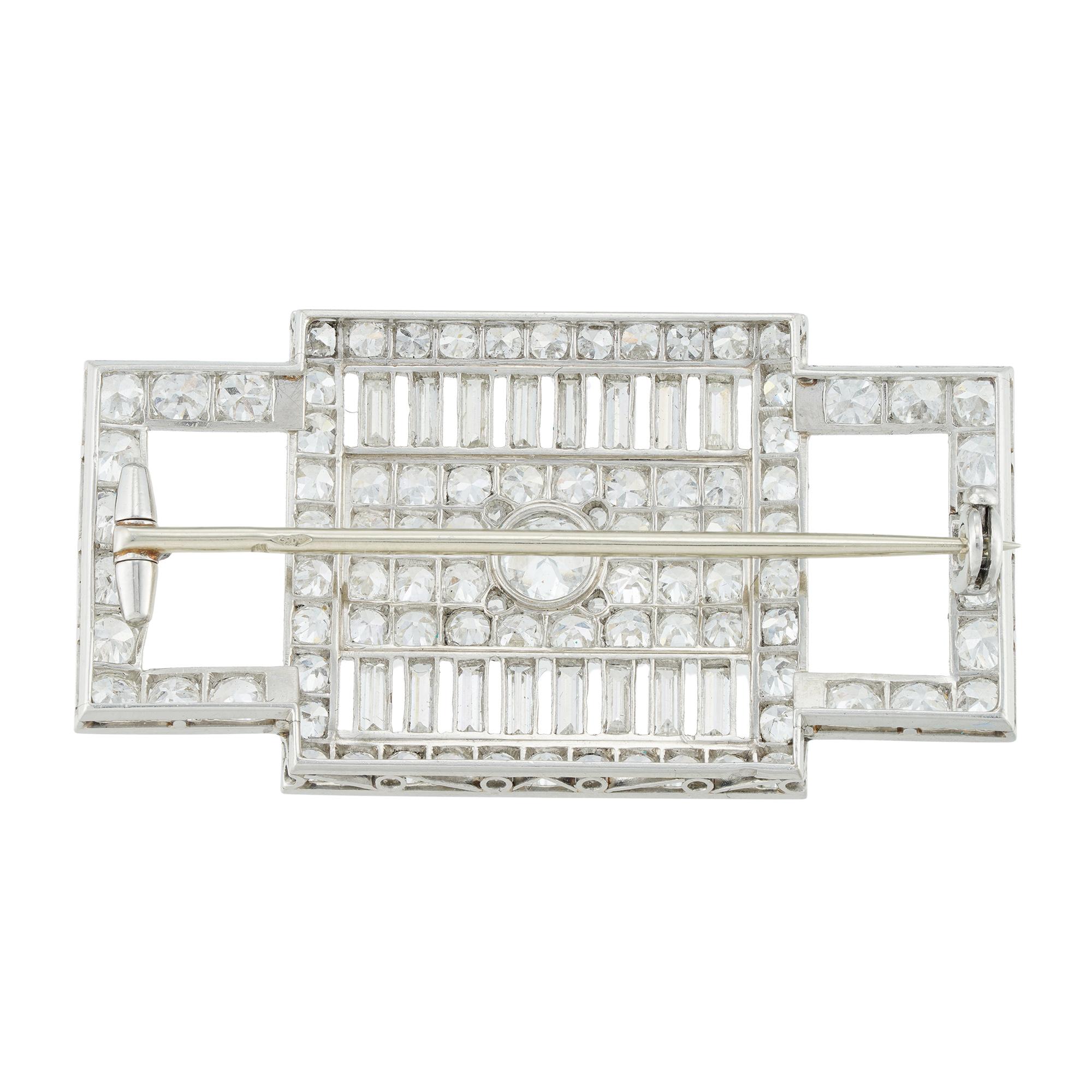 A French Art Deco diamond set brooch by Lambert Frères, of rectangular shape with an openwork pattern, set with central round brilliant-cut diamond estimated to weigh 0.40 carats, to a round brilliant-cut diamond-set panel, with baguette-cut