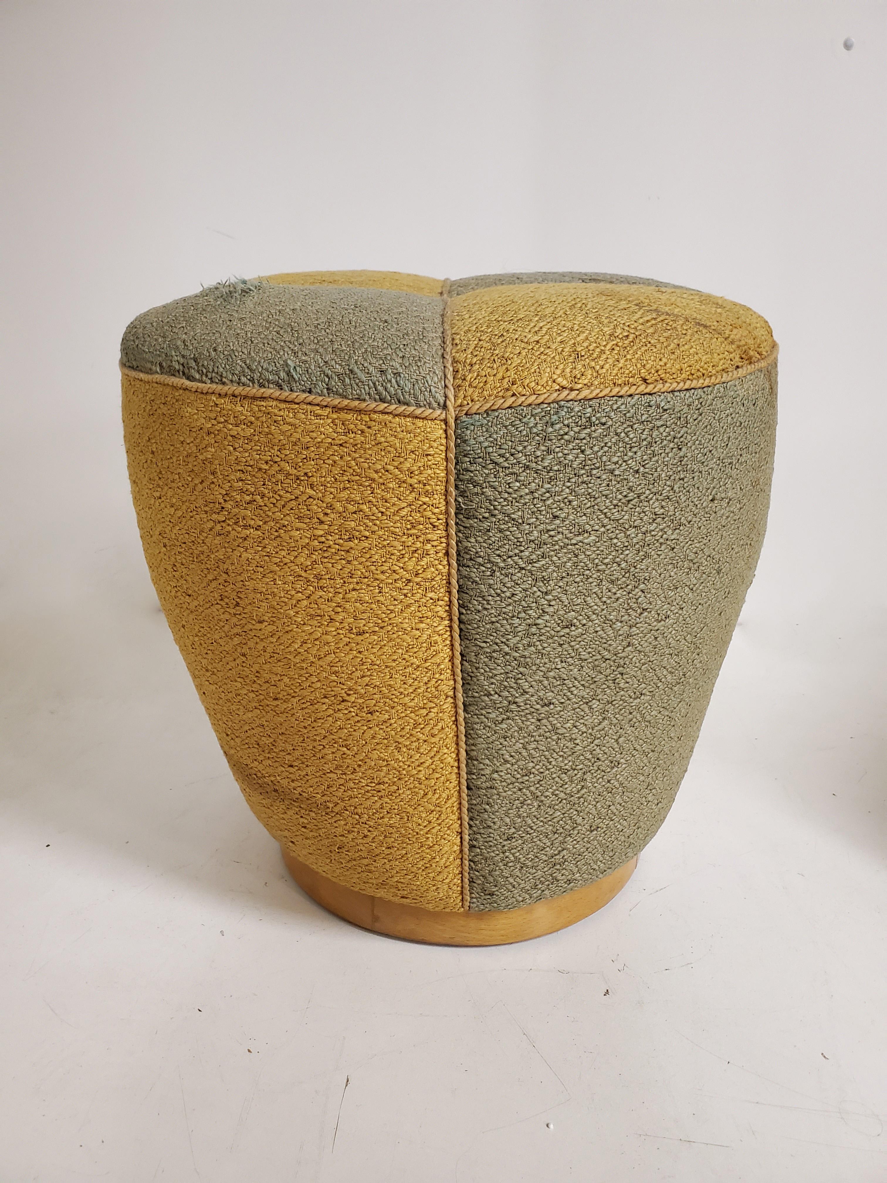 An original  Art Deco upholstered pouf or stool by Jindrich Halabala for UP Závody,
A lovely blond wood base supports the conical shape cushion which is divided into different colored sections like a harlequin's garb. 
The curved wood base has