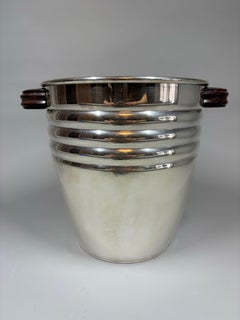 A French Art Deco silver-plated champagne/ wine cooler with rosewood handles