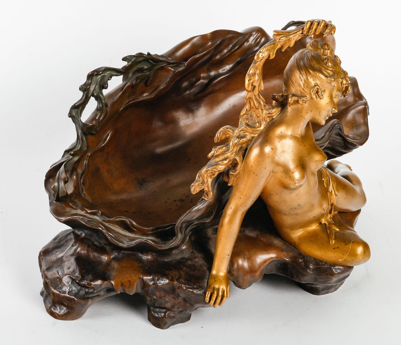 A French Art Nouveau bronze Vide-Poche Centerpiece  
Depicting a Naiad resting by a shell on a rock
Signed Auguste Moreau on the rock
Three patinas
Circa 1900

Auguste Moreau (1834-1917) belongs to the Moreau family, a dynasty of 19th and early 20th