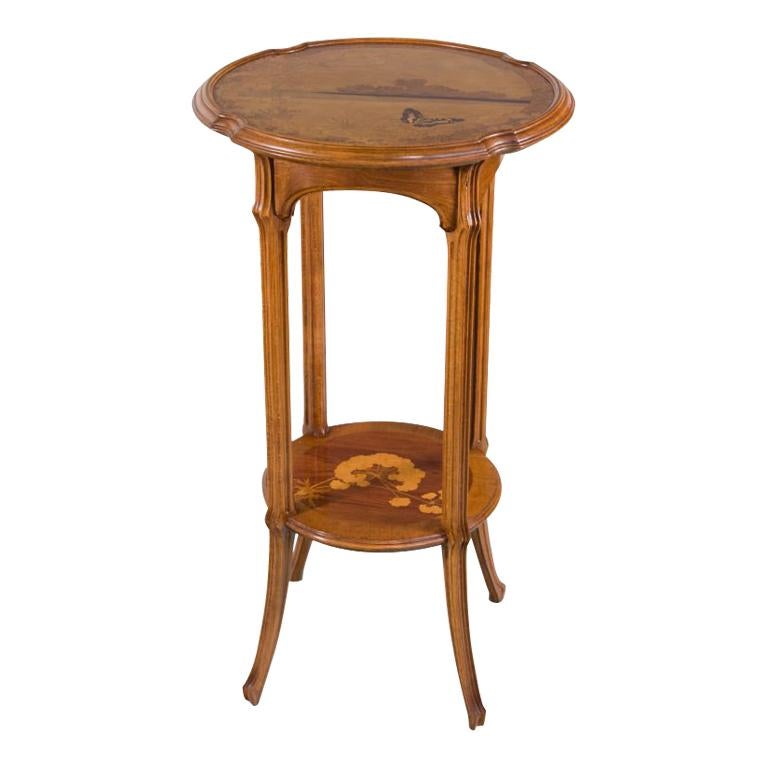 A French Art Nouveau Carved Wood and Inlaid Marquetry "Ombelle" Occasional Table