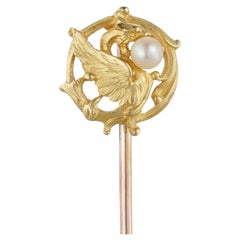 A French Art Nouveau gold and pearl stick pin