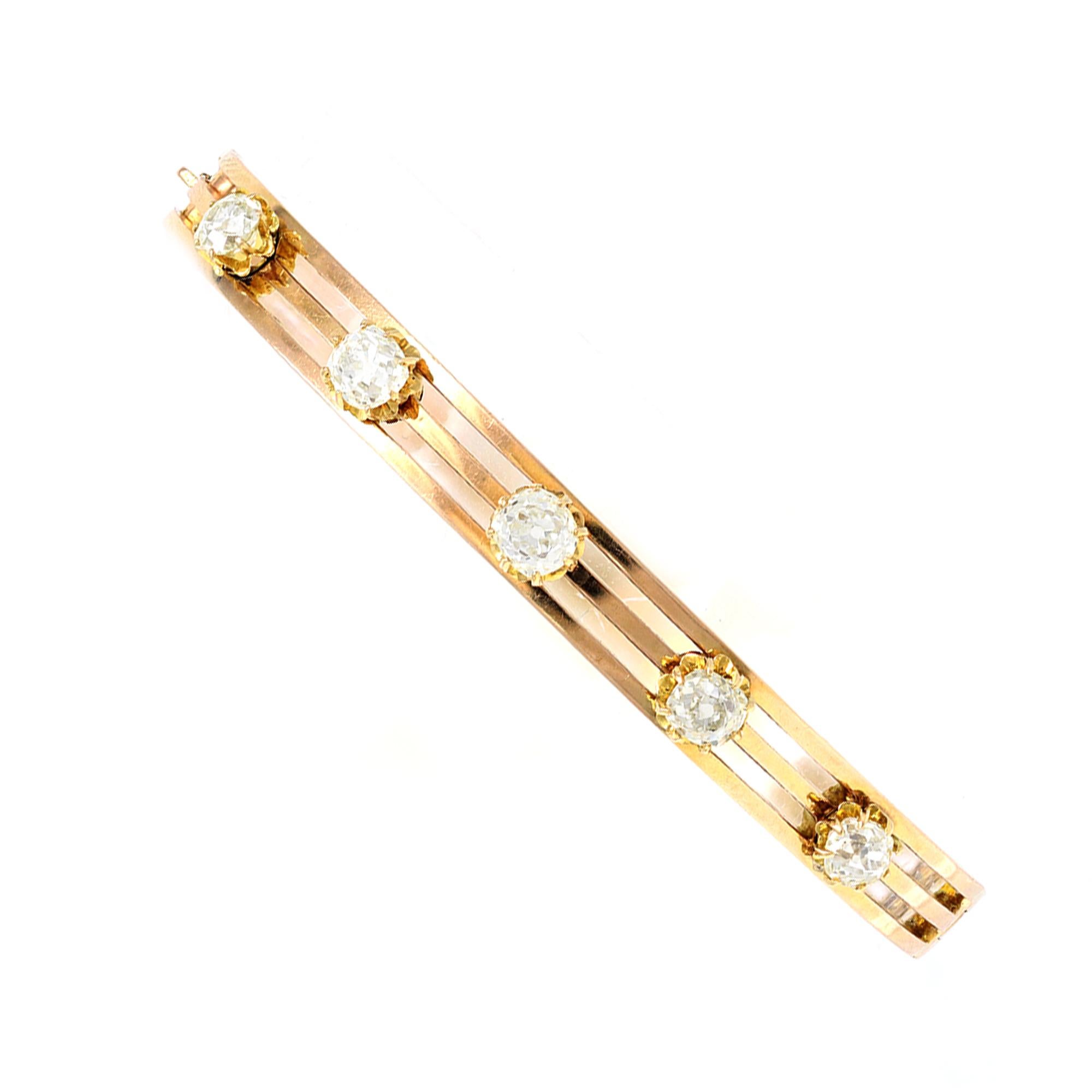 A French Belle Époque bangle Diamond bracelet set in 18K gold from the late 19th century early 20th century. Featuring five old mine cut Diamonds with a total estimated weight of 2.30 carats, this French bracelet is set in 18K yellow gold. The