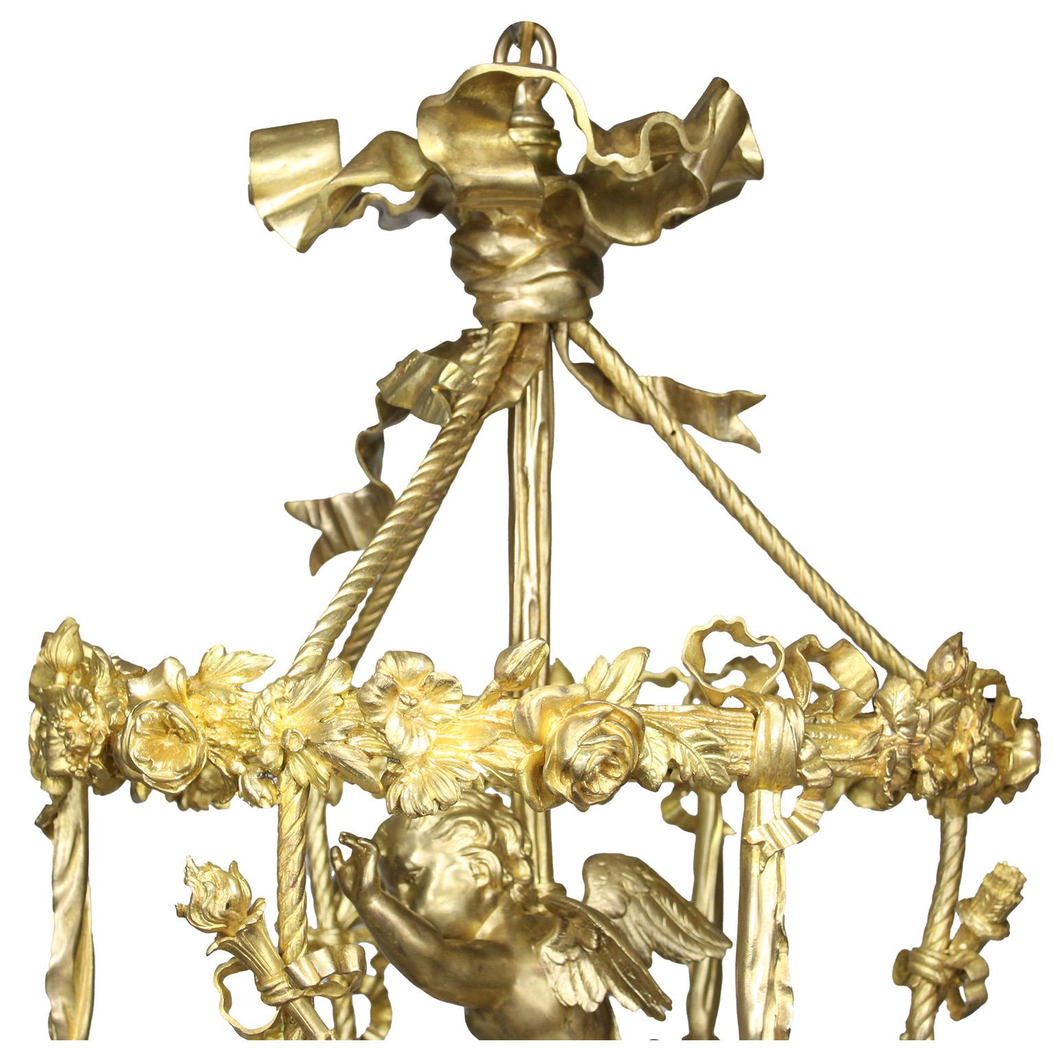 Lámpara de araña francesa de la Belle Époque, de bronce dorado, de cuatro luces, con forma de querubín o cupido principios del siglo XX en venta