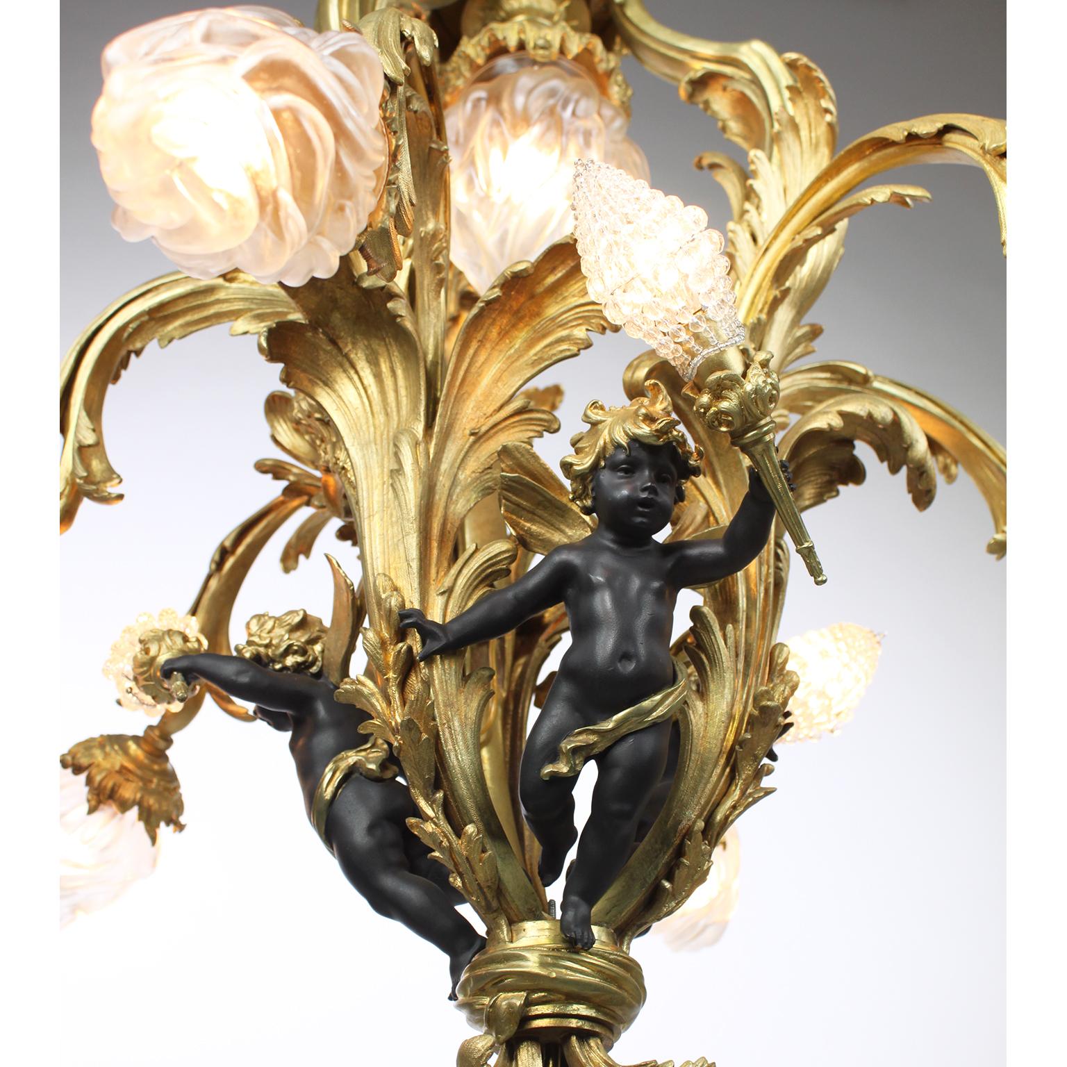 Ebonized A French Belle Époque Gilt Bronze & Patinated Bronze Ten-Light Cherub Chandelier For Sale
