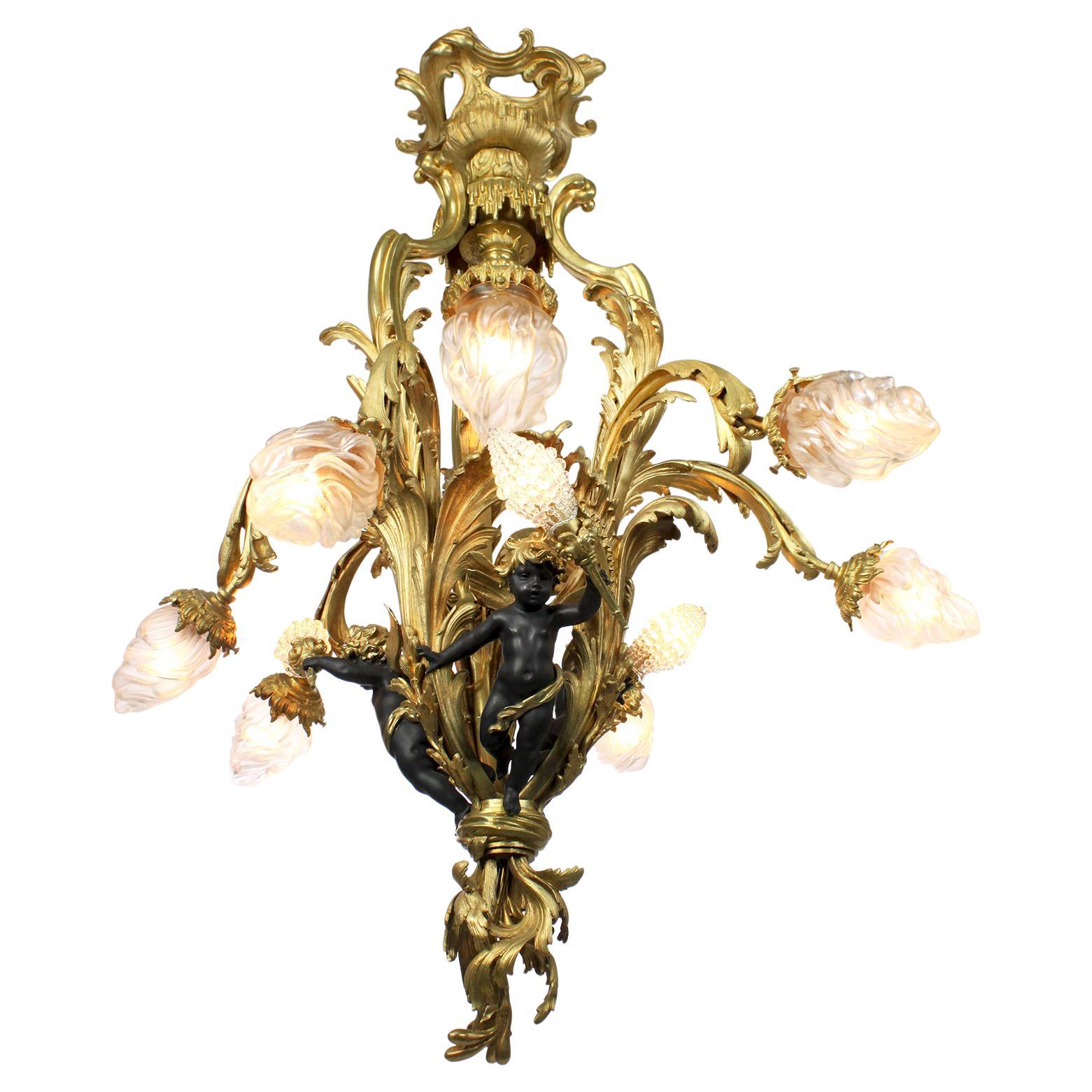 A French Belle Époque Gilt Bronze & Patinated Bronze Ten-Light Cherub Chandelier For Sale