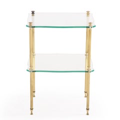 A French brass and glass tiered end table, C. 1960.