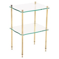 A French brass and glass tiered end table, C. 1960.