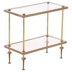 A French brass and glass tiered table, in the manner of Bagues, C. 1950.