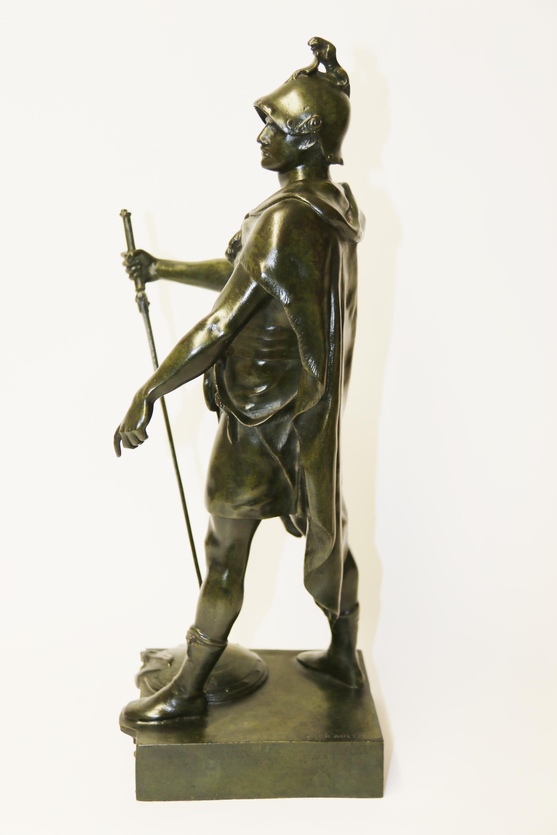 This superbly cast late 19th century bronze figure depicts a standing soldier with sword in hand resting with the tip onto a shield at his feet with the inscribed words Honor Patria.
This bronze figure stands on a plinth base with a brass title