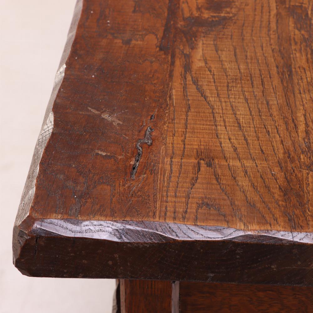 A striking French oak sideboard designed in the Brutalist style. Crafted from solid oak, it features bold lines, substantial proportions, and distinctive iron strap hinges that underscore its architectural presence. The sideboard offers generous