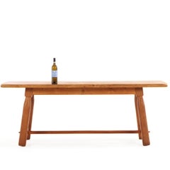 A French Brutalist style solid oak dining table, C. 1950.
