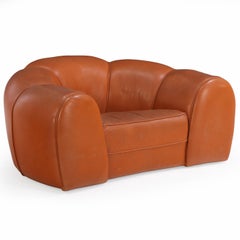 A French Bulbous Croissant-shaped Leather Chair, C. 1985.