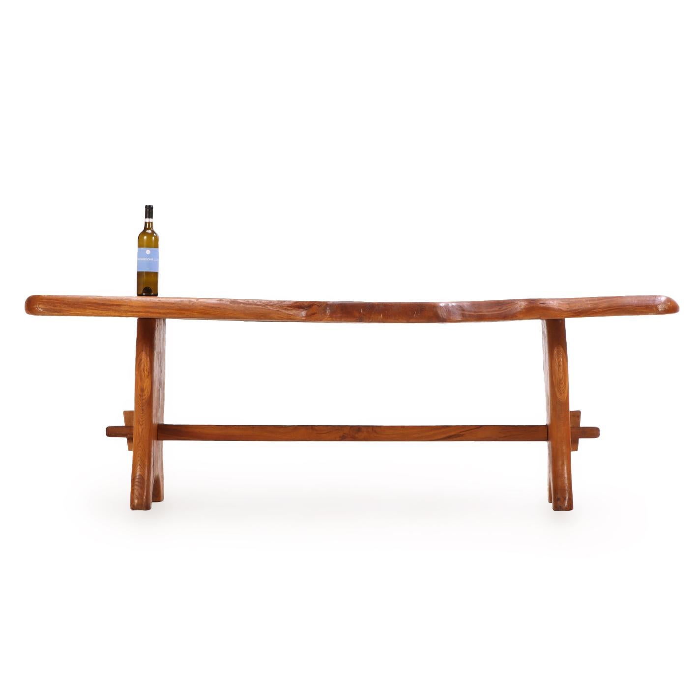 A French burled elm free edge dining table, C. 1970. In Good Condition For Sale In Philadelphia, PA
