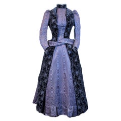 A French bustle cage day Dress in silk moire and purple chiseled velvet C. 1885