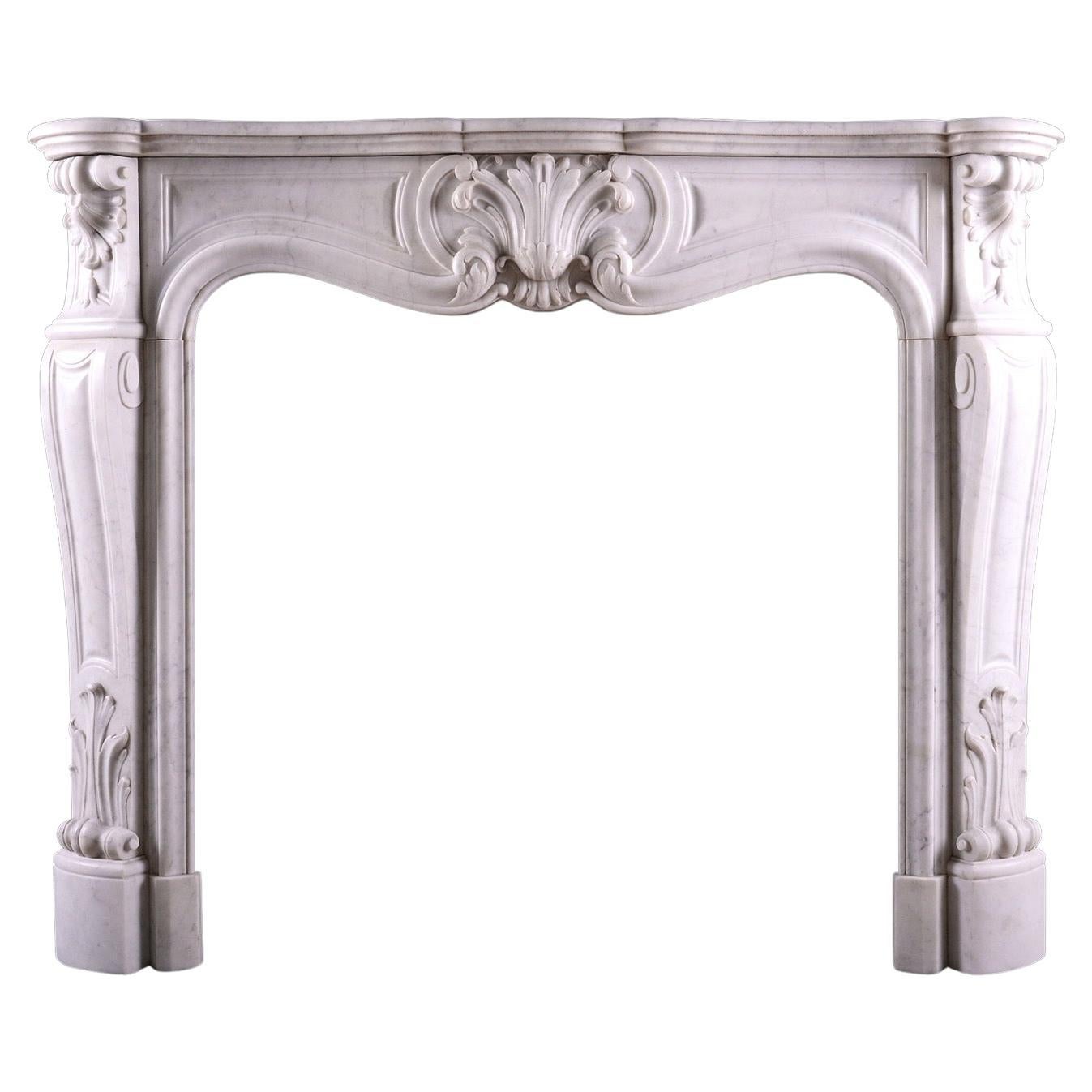 A French Carrara Marble Fireplace in the Louis XV Style For Sale