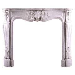 A French Carrara Marble Fireplace in the Louis XV Style