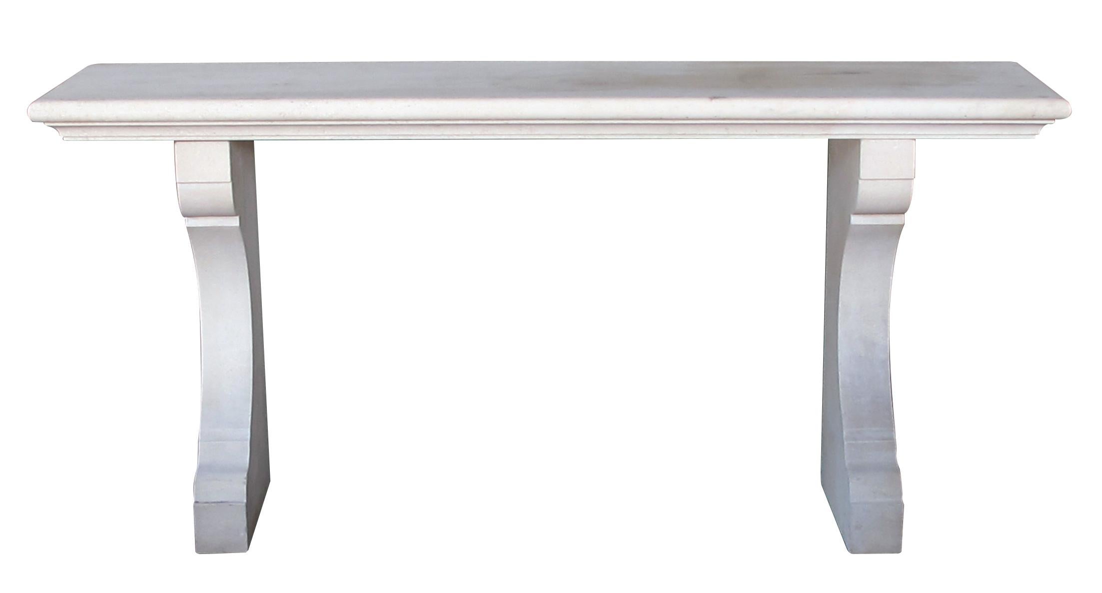 imported from France and in three pieces, the thick rectangular top with ogee edge raised on concave supports; great for outdoor patio or interior use
