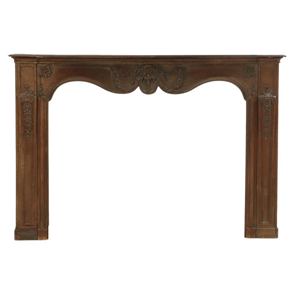 A French Carved Oak Fireplace Mantel, 18th C. For Sale