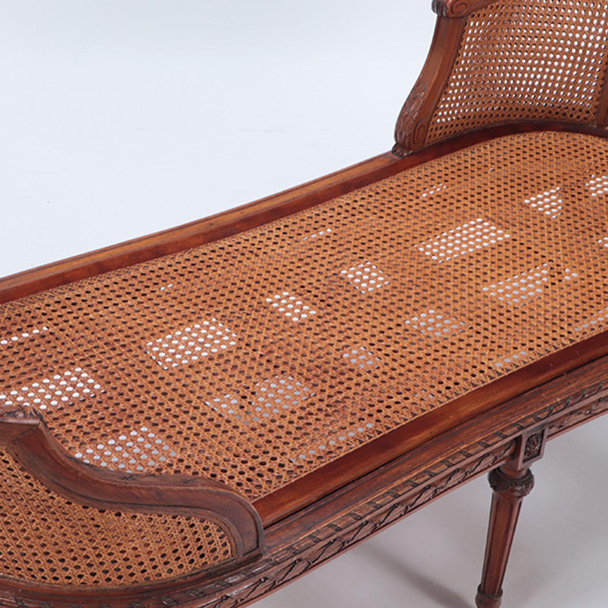 Cane French Carved Walnut Chaise Lounge in the Louis XVI Style, circa 1900 For Sale